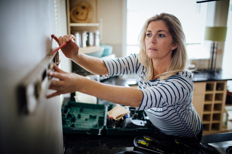 Woman doing DIY in the Kitchen