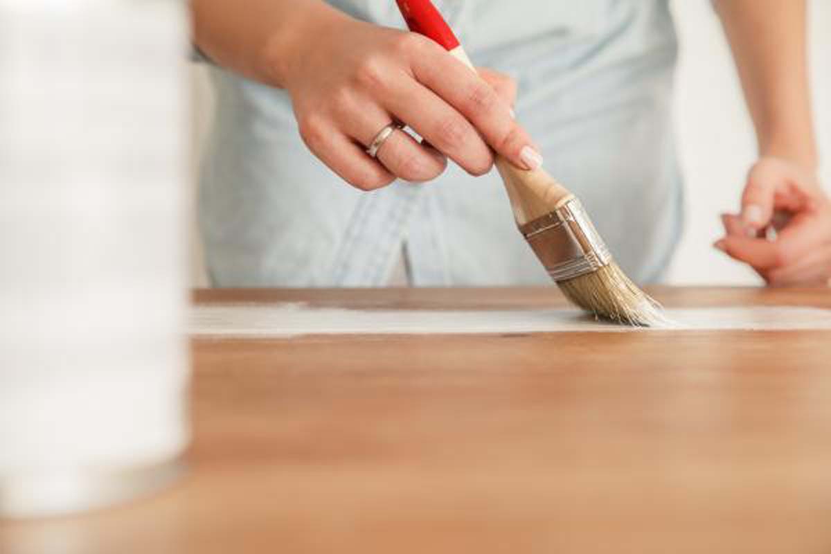 close-up-of-woman-painting-furniture