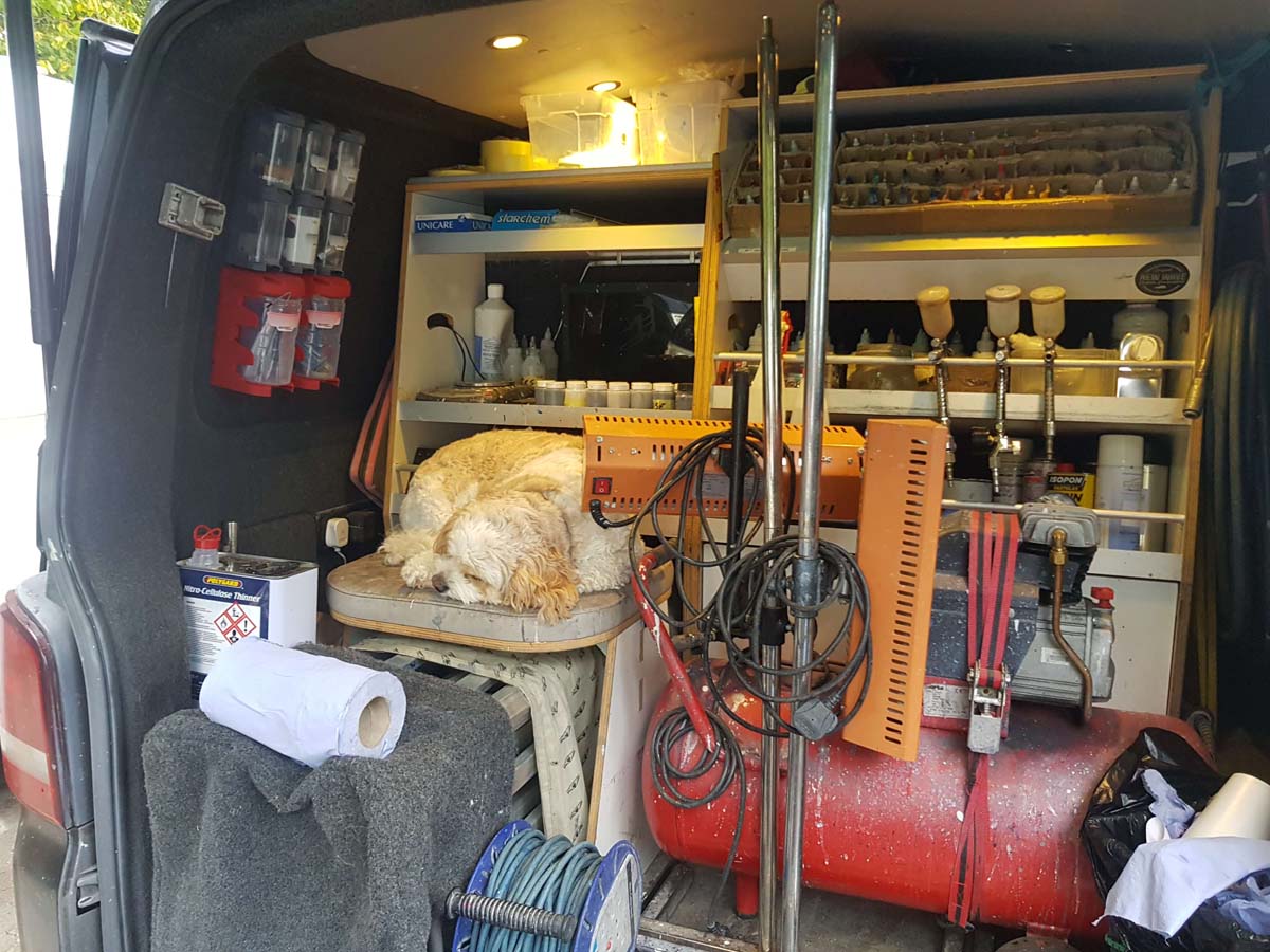 Max the dog sleeping in van