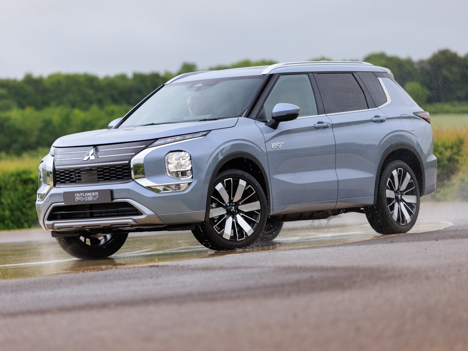 A light blue Mitsubishi Outlander PHEV