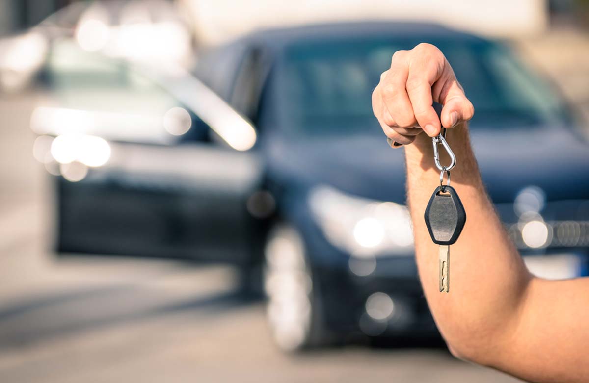 someone-handing-over-keys-for-a-hire-car