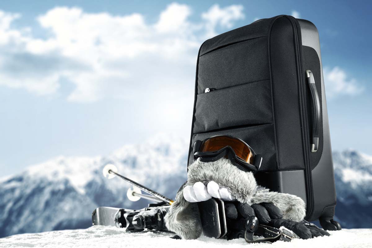 closed-suitcase-standing-on-snow