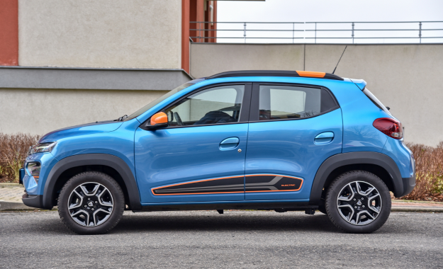 blue dacia spring on road