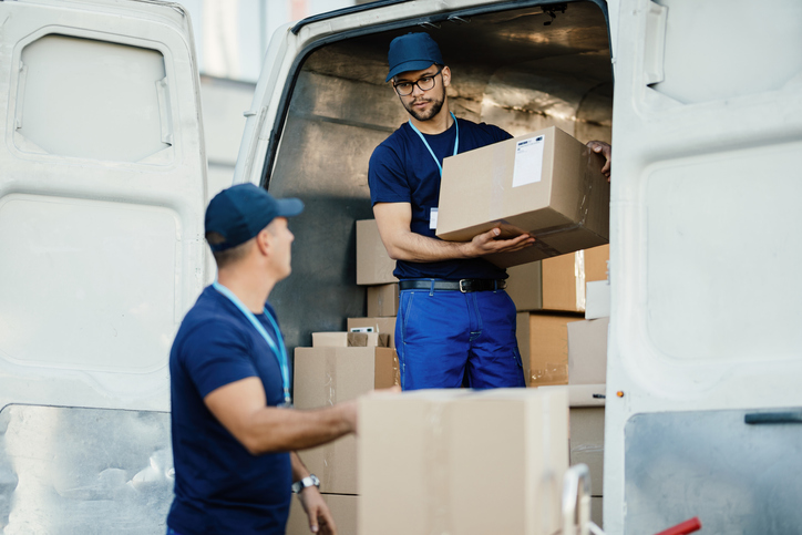 delivery men loading a van