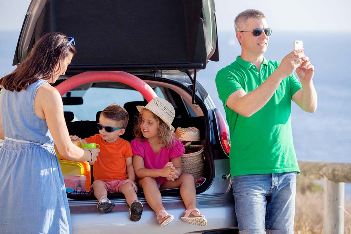 a-family-sat-in-their-car-boot-eating