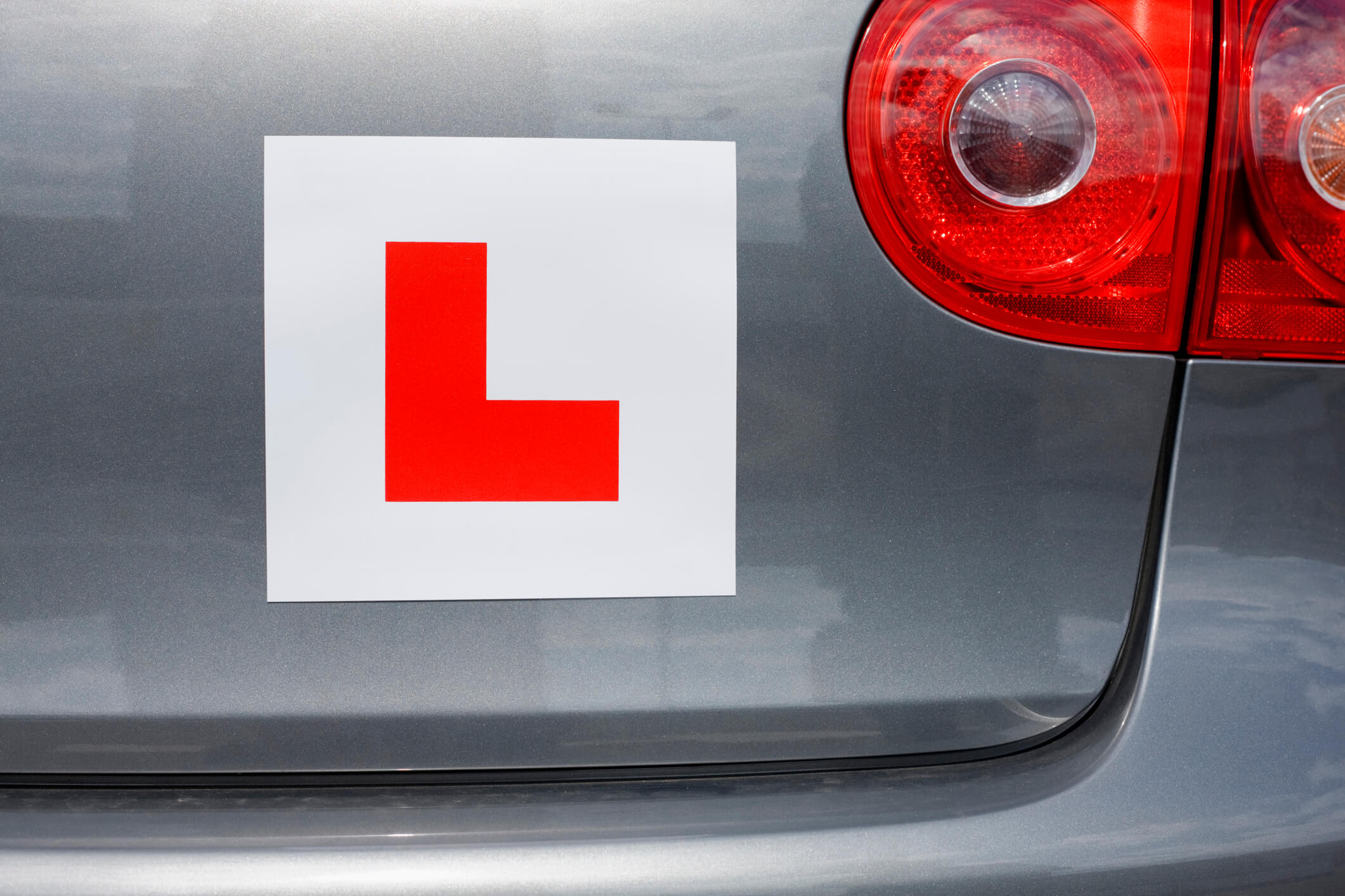 L plate on a silver car