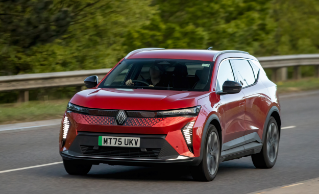 red renault scenic e-tech driving on road