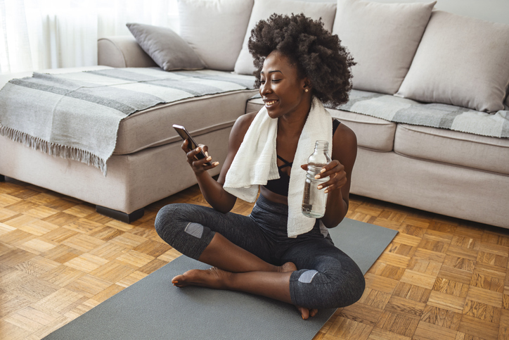 woman-exercising-at-home-using-app