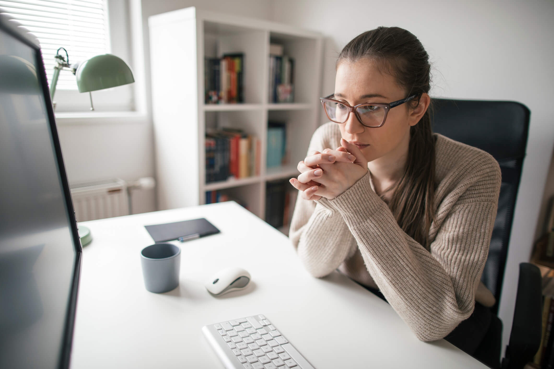 young woman working in home office