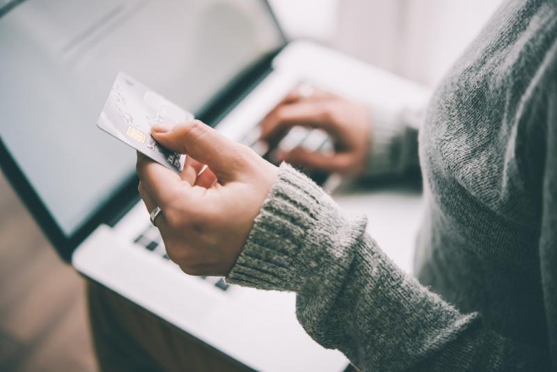 A woman buying something with a credit card