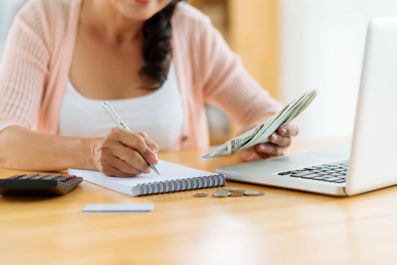 A woman budgeting at a table