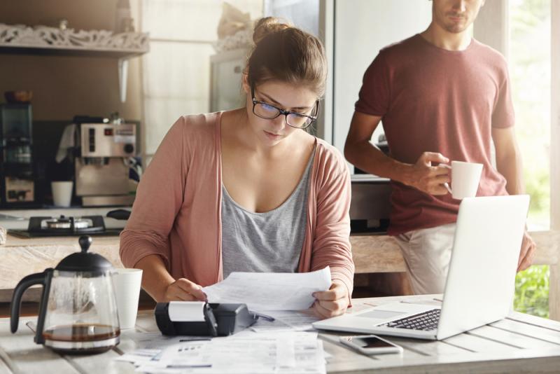 woman-budgeting-kitchen-table