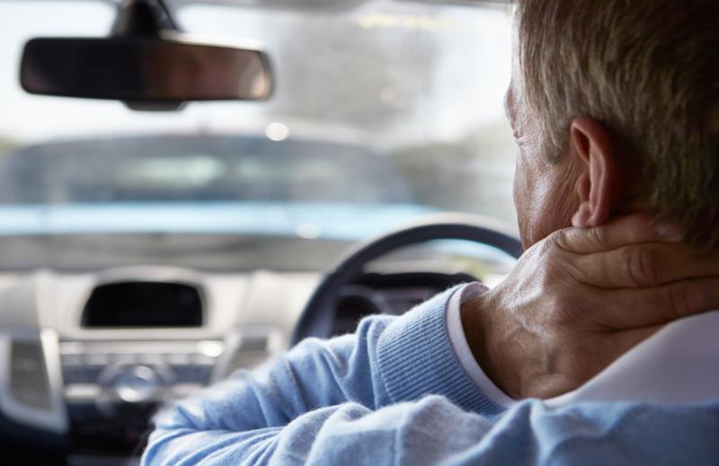 man-holding-his-neck-after-a-car-accident