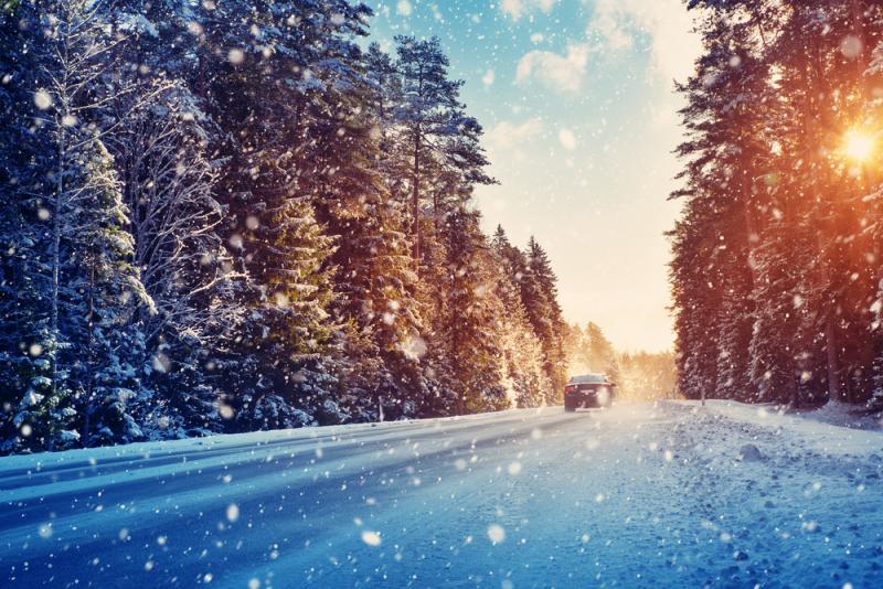 car-driving-down-a-snowy-road
