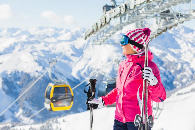 happy-woman-skier-by-chair-lift
