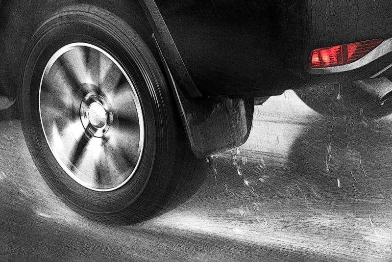 close-up-of-car-tyre-on-wet-road