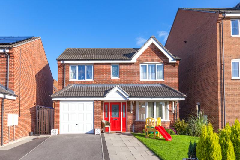 detached-house-with-red-door-and-garage