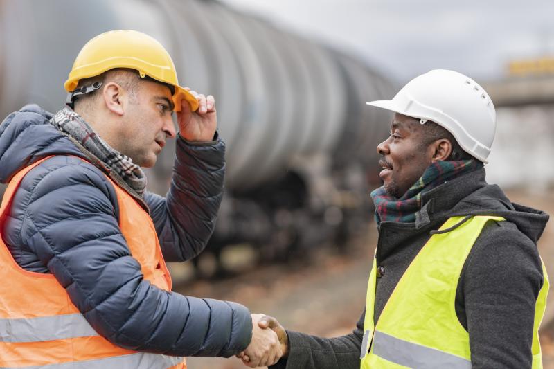 two builders shaking hands
