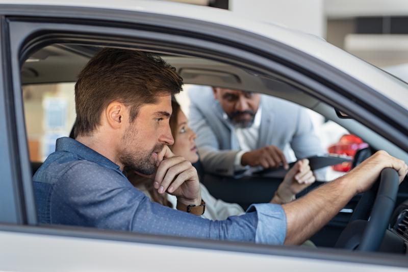 couple-test-driving-a-car