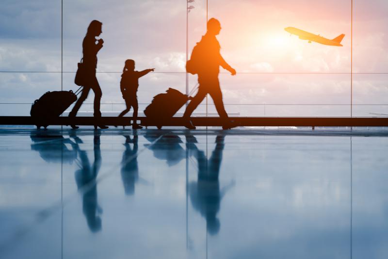 family walking through airport