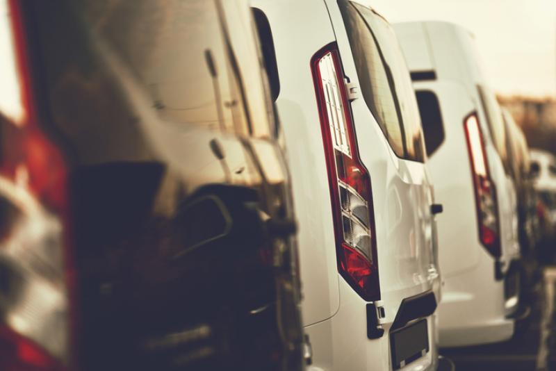 row of vans at the dealership