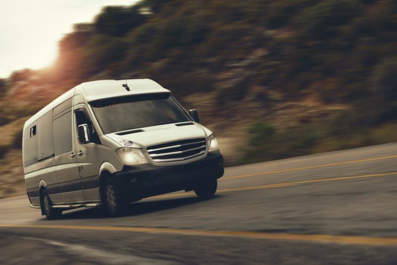 van driving down a road