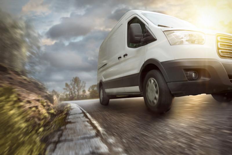 van driving down a country road