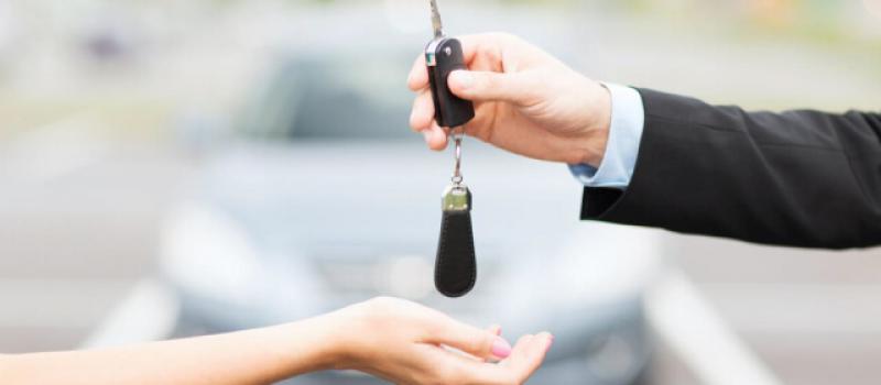 person-handing-over-a-car-key