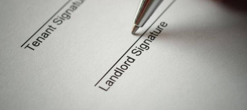 landlord-signing-tenancy-agreement