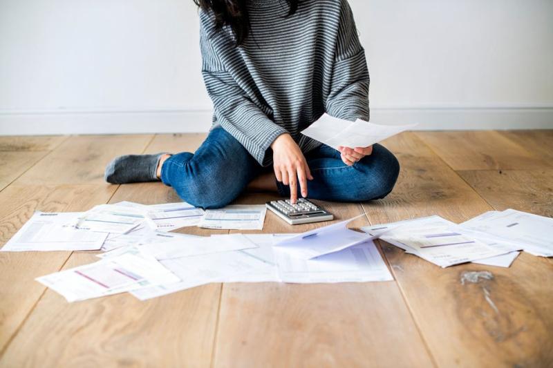 woman looking at bills