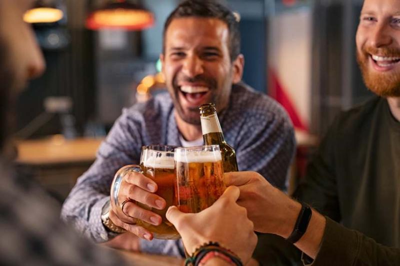 Image of a group of men enjoying a drink