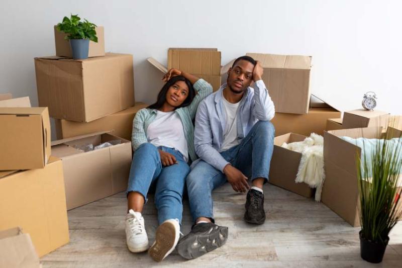 Image of a black couple experiencing house moving stress