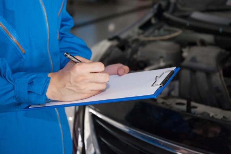 Image of a mechanic performing an MOT