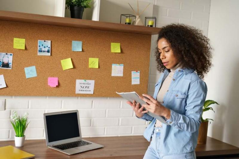 Image of a woman ticking off a checklist