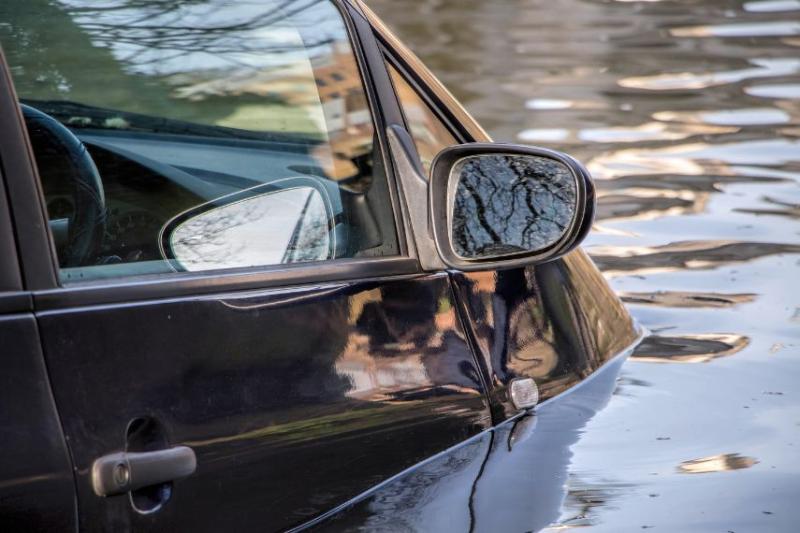 Black car submerged in water