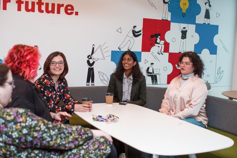 Women employees at Admiral sitting at a table