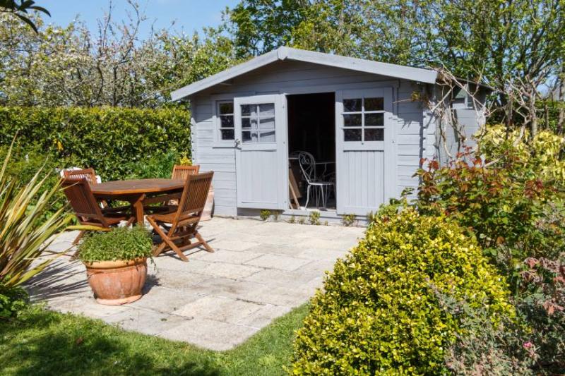 Shed with table and chairs outside
