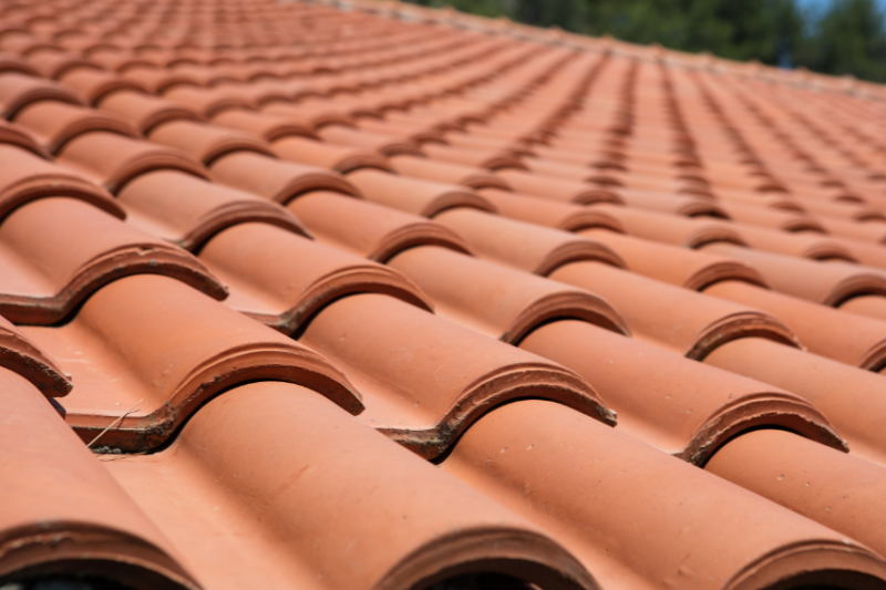 close up photo of red roof tiling 