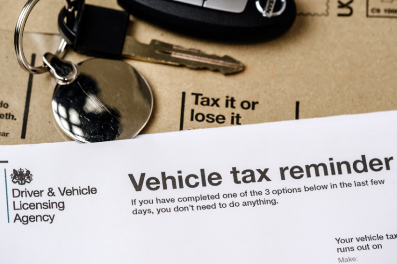 car tax reminder letter next to car keys