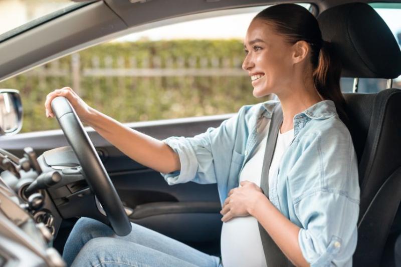 A pregnant woman driving