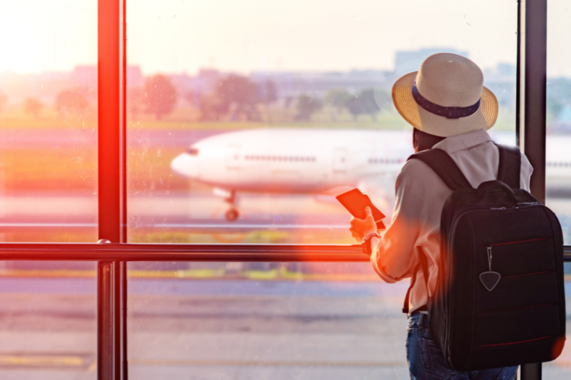 Someone waiting in the airport looking at the plane