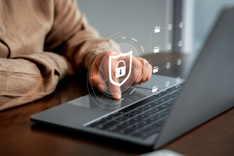person using graphic with white hologram floating above keyboard