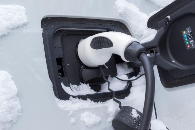 photo of EV charging port of snowy car