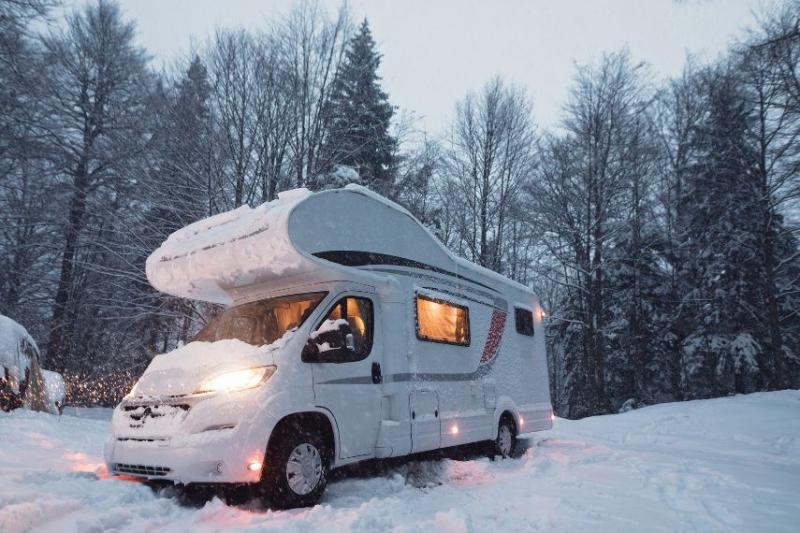 A white campervan in the snow