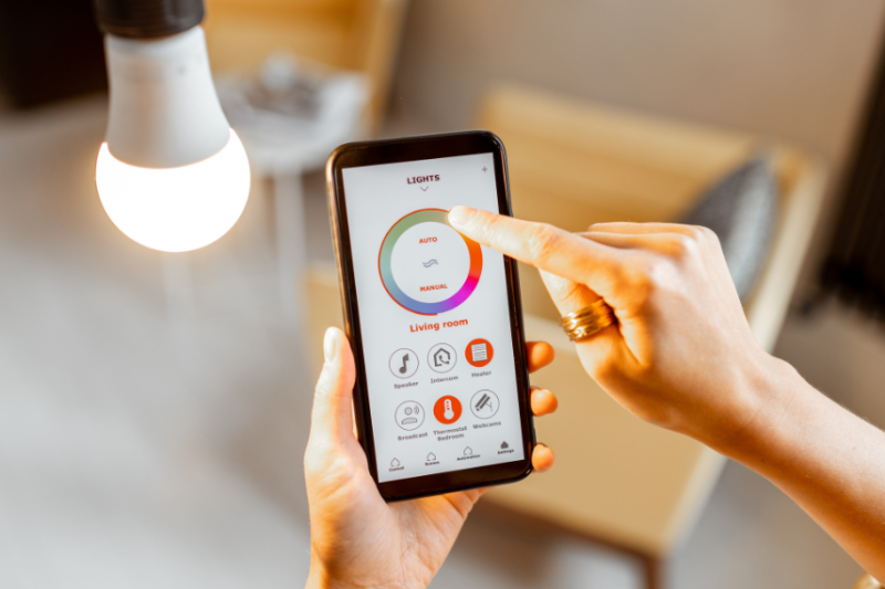 person using app to control smart bulb