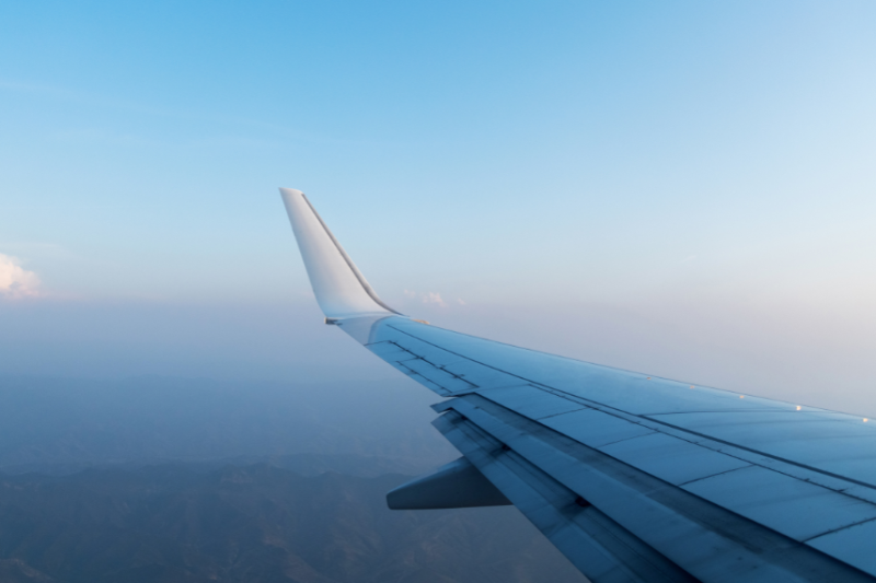 image of plane's wing in mid flight