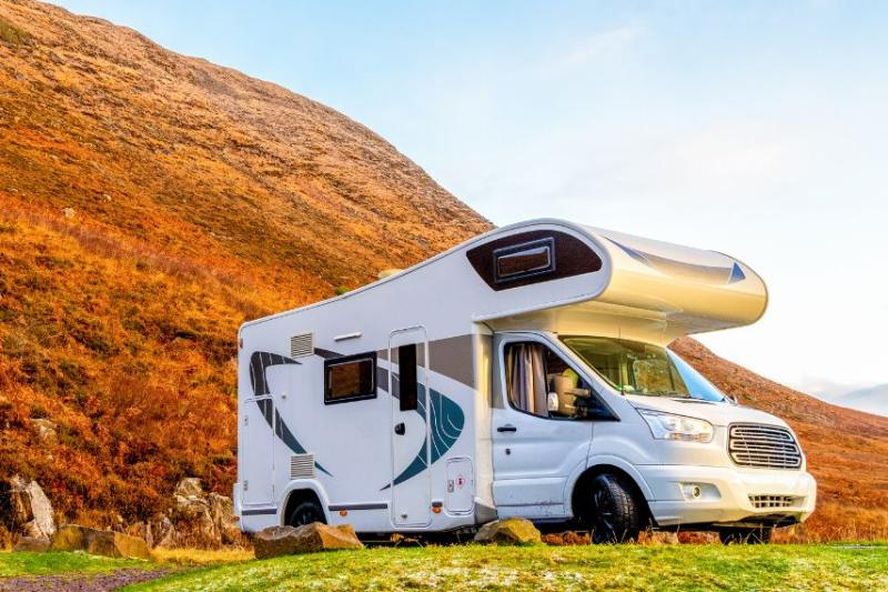 image of motorhome parked in field