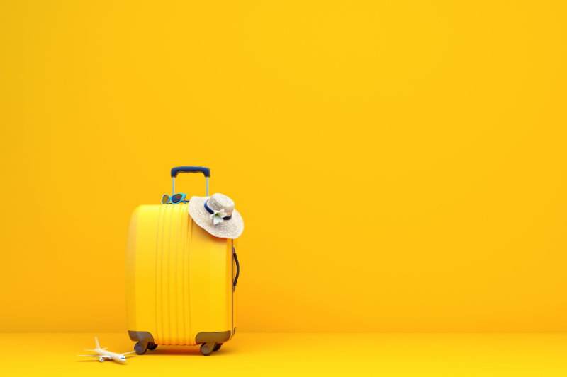 picture of yellow suitcase against yellow background