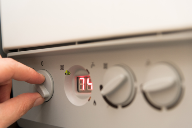 person changing boiler settings