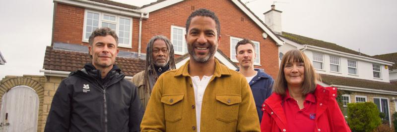 Flood Force team standing in front of home